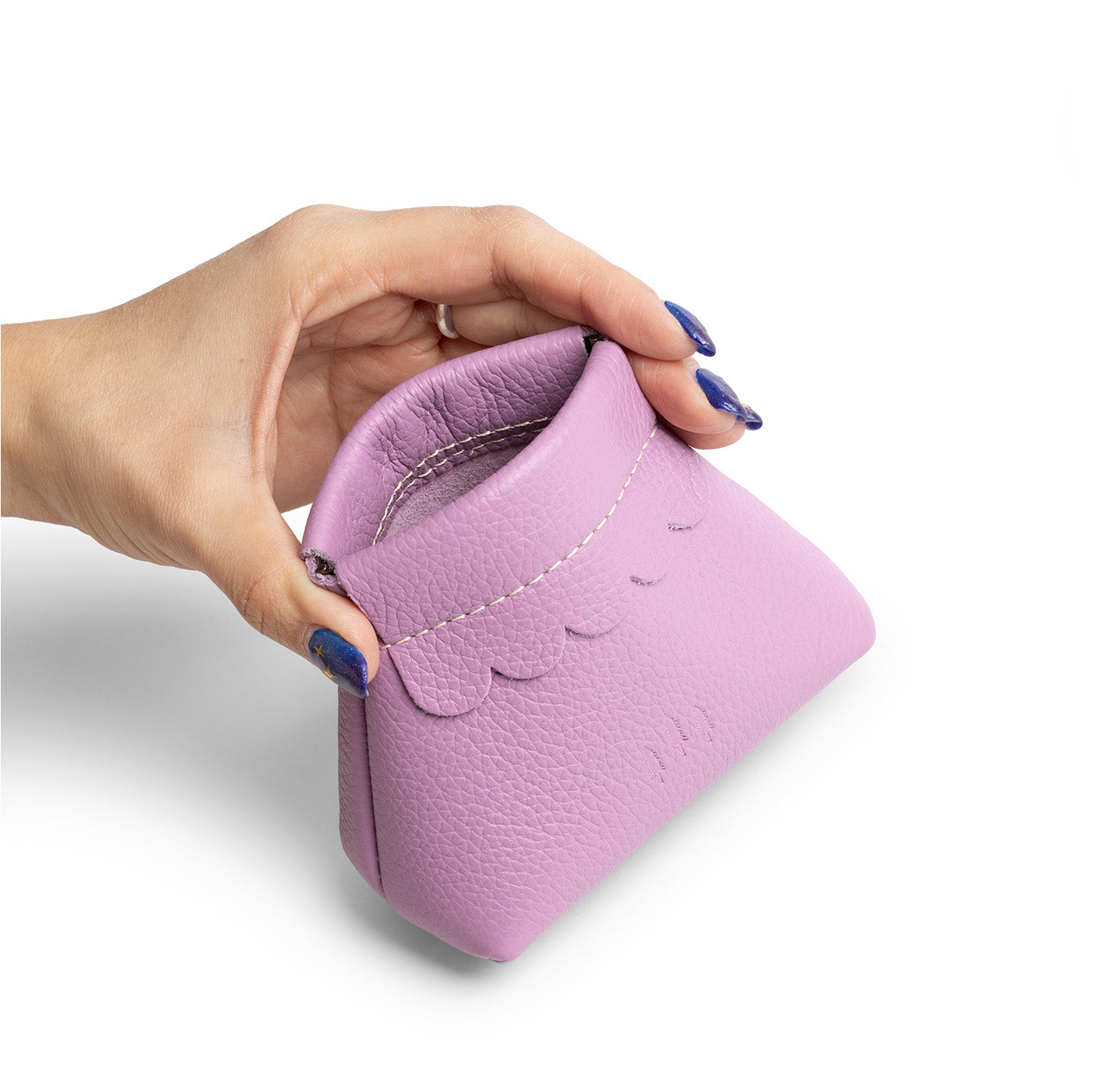 Calla Lily | Hand holding leather coin pouch with scalloped edge and three Portland leather tree emblems open