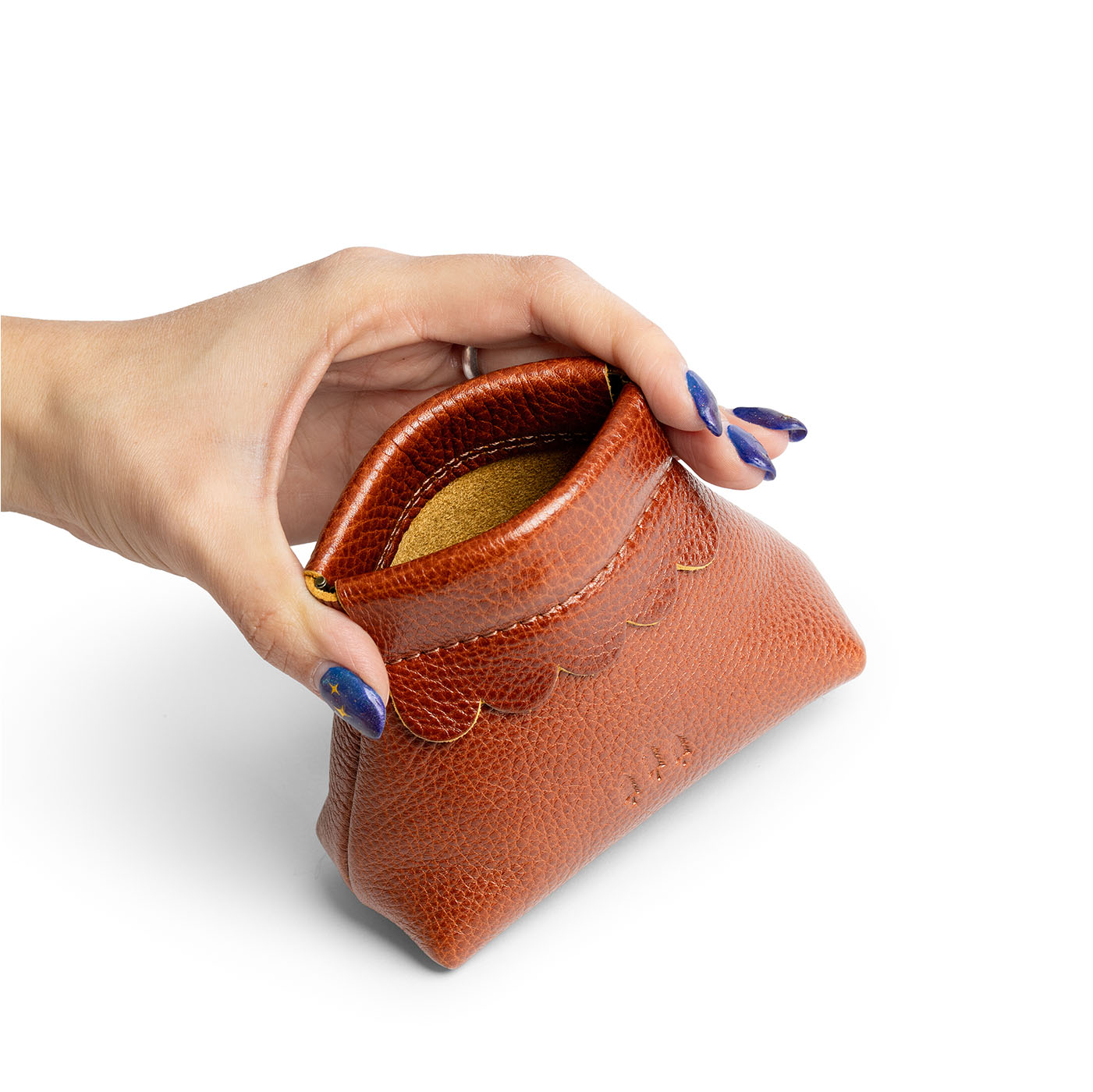 Sienna | Hand holding leather coin pouch with scalloped edge and three Portland leather tree emblems open