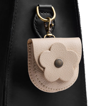 Pebbled Bone | U shaped pouch with leather flower applique