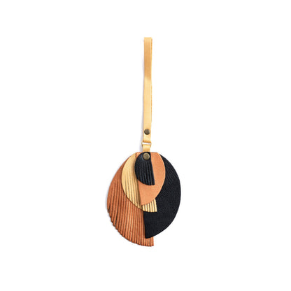 Cleopatra | Intricately cut leather shapes and fringe