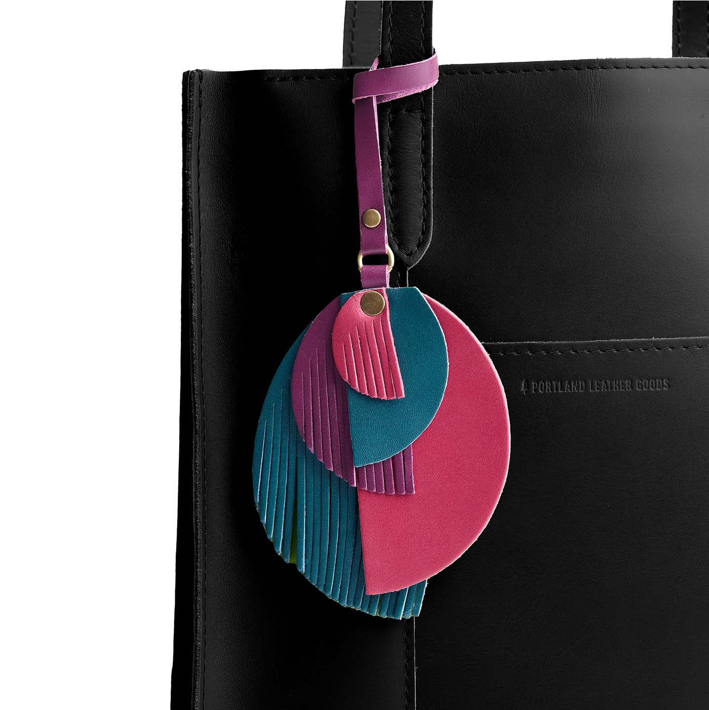 Enchanted | Intricately cut leather shapes and fringe