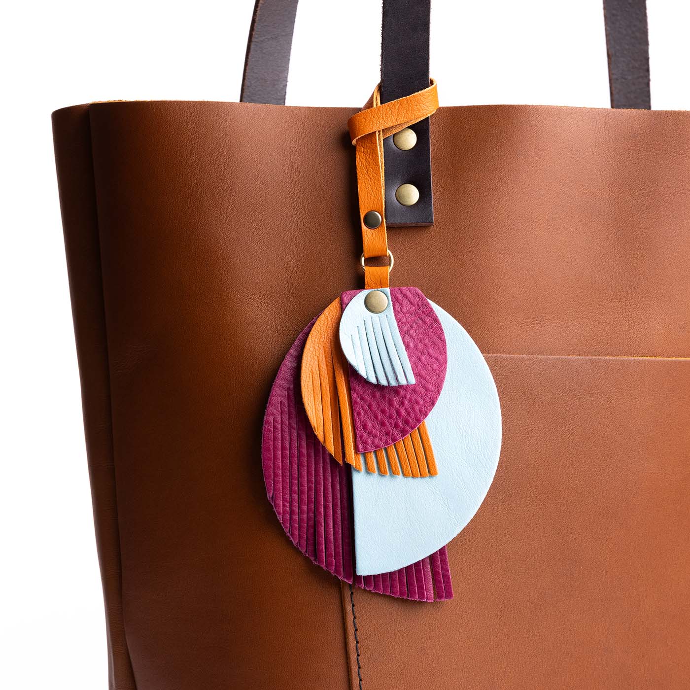 Luka | Intricately cut leather shapes and fringe