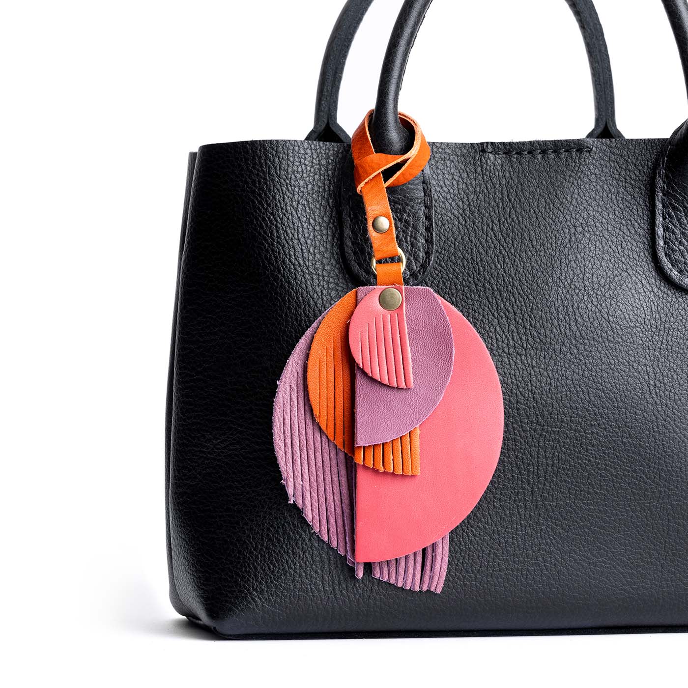 Merry Berry | Intricately cut leather shapes and fringe