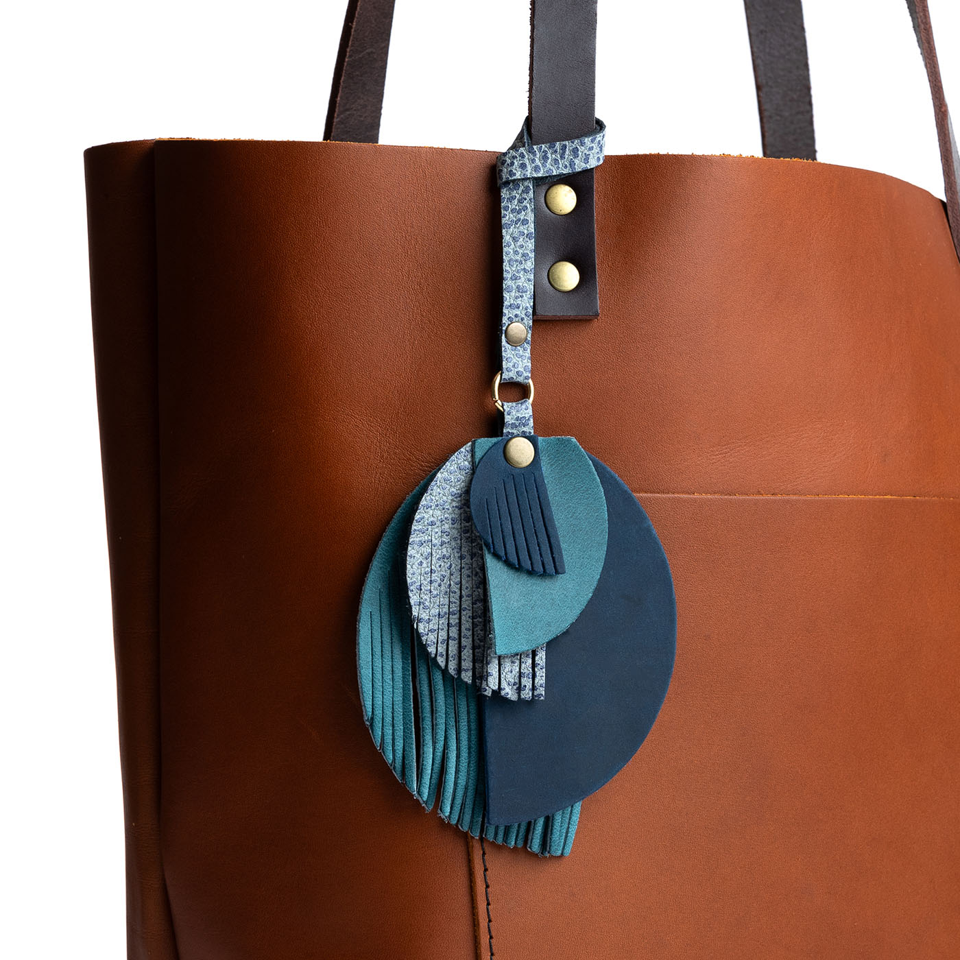 Neptune | Intricately cut leather shapes and fringe