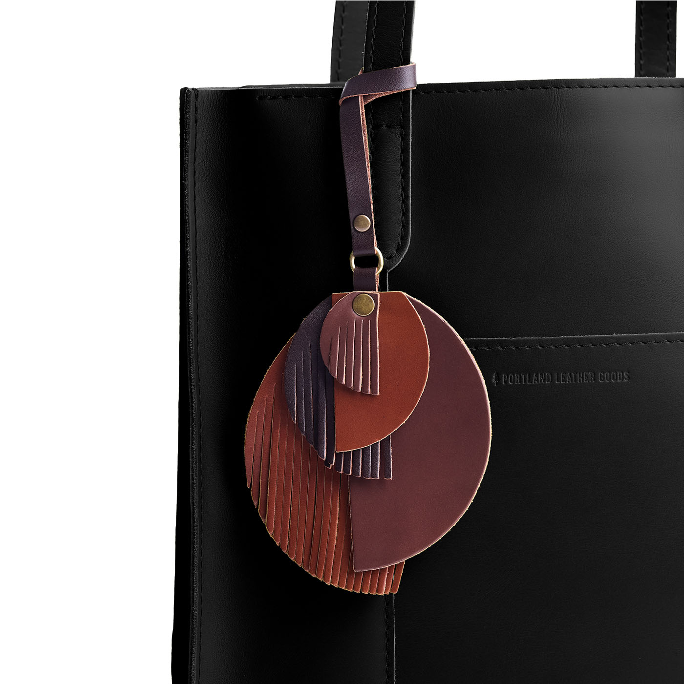Portrait | Intricately cut leather shapes and fringe