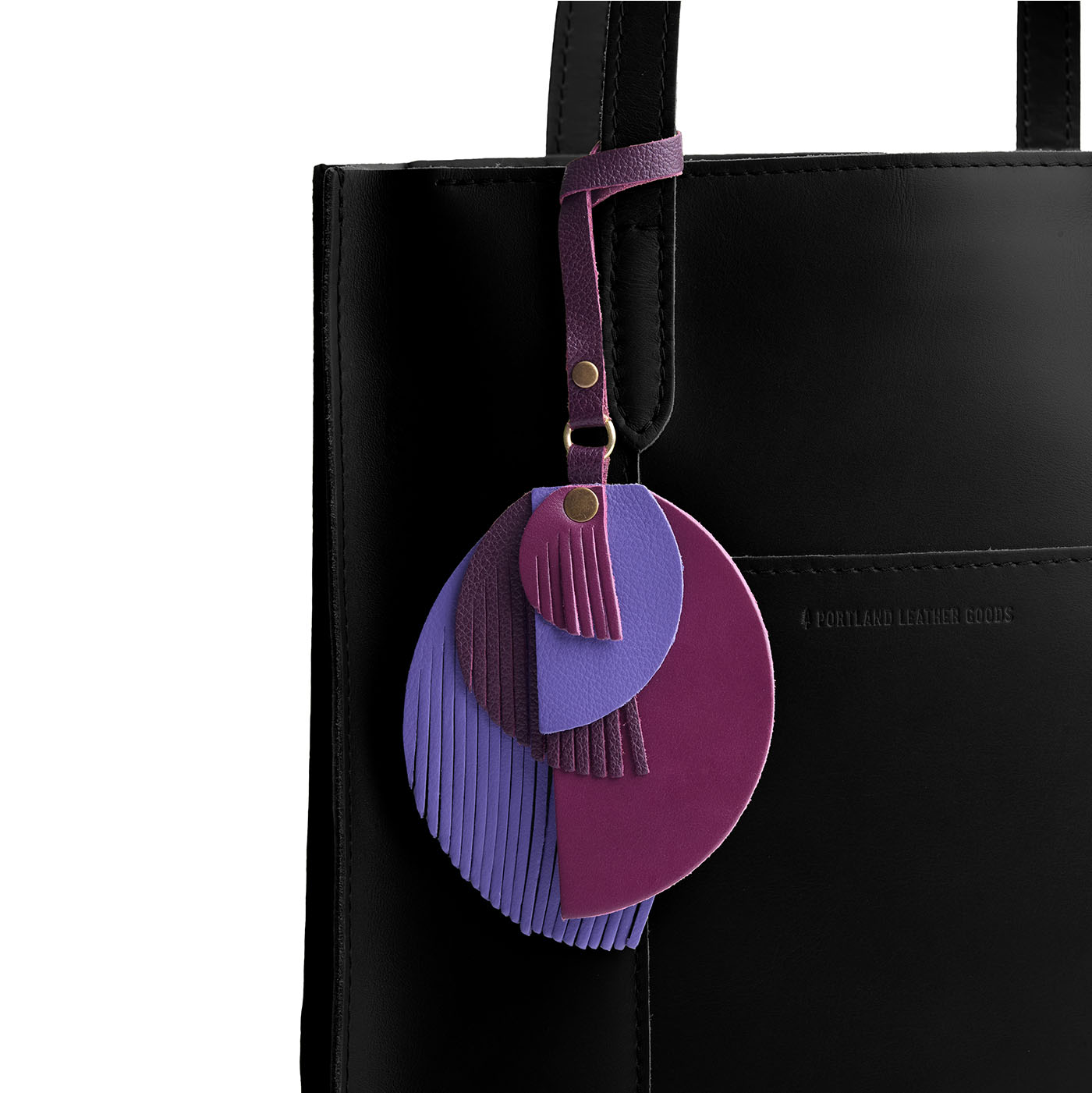Sphere | Intricately cut leather shapes and fringe