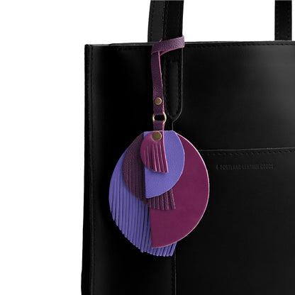 Sphere | Intricately cut leather shapes and fringe