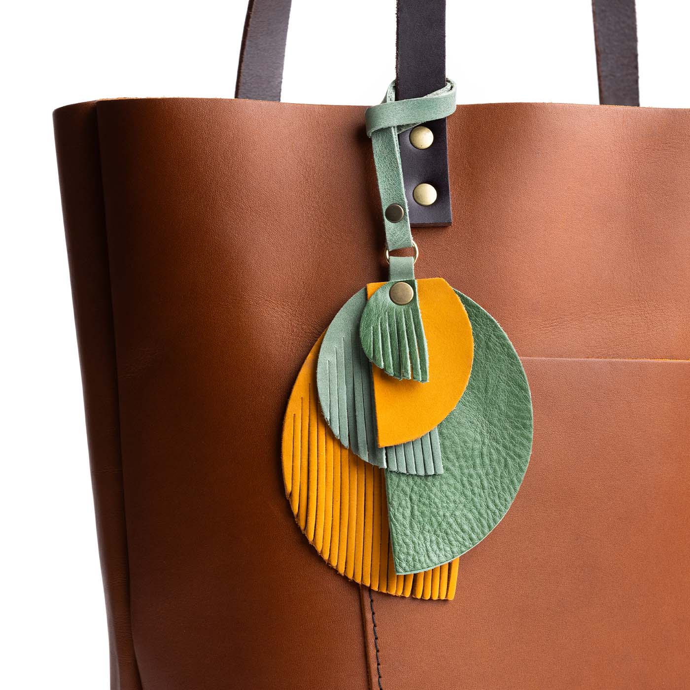 Toucan | Intricately cut leather shapes and fringe