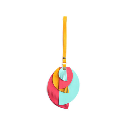 Tropical | Intricately cut leather shapes and fringe