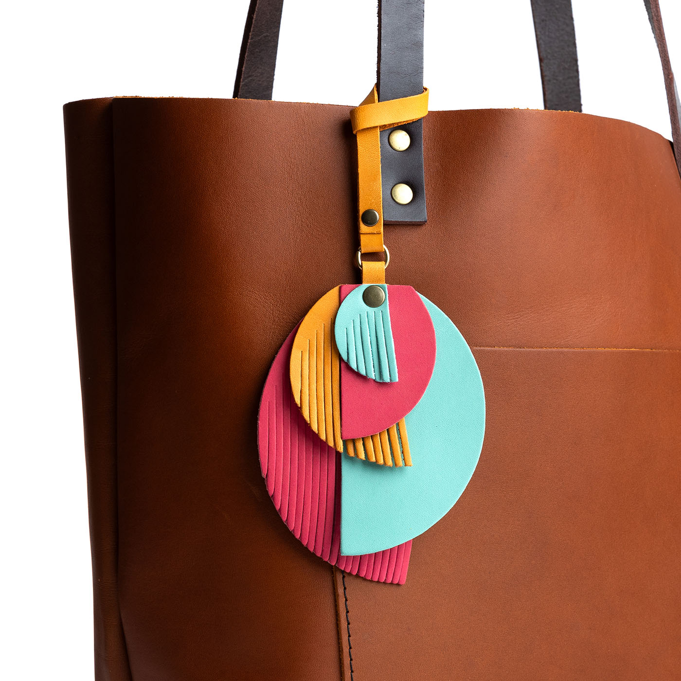 Tropical | Intricately cut leather shapes and fringe
