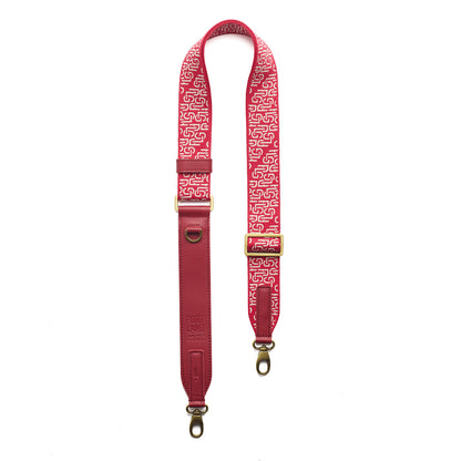 Firepop | Leather and webbing strap with repeating PLG lettering on a white background