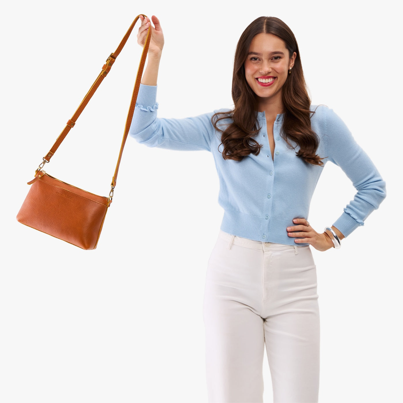 Sienna*Small | Model wearing a zip top crossbody bag with detachable strap