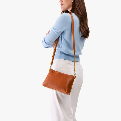 Sienna*Small | Model wearing a zip top crossbody bag with detachable strap
