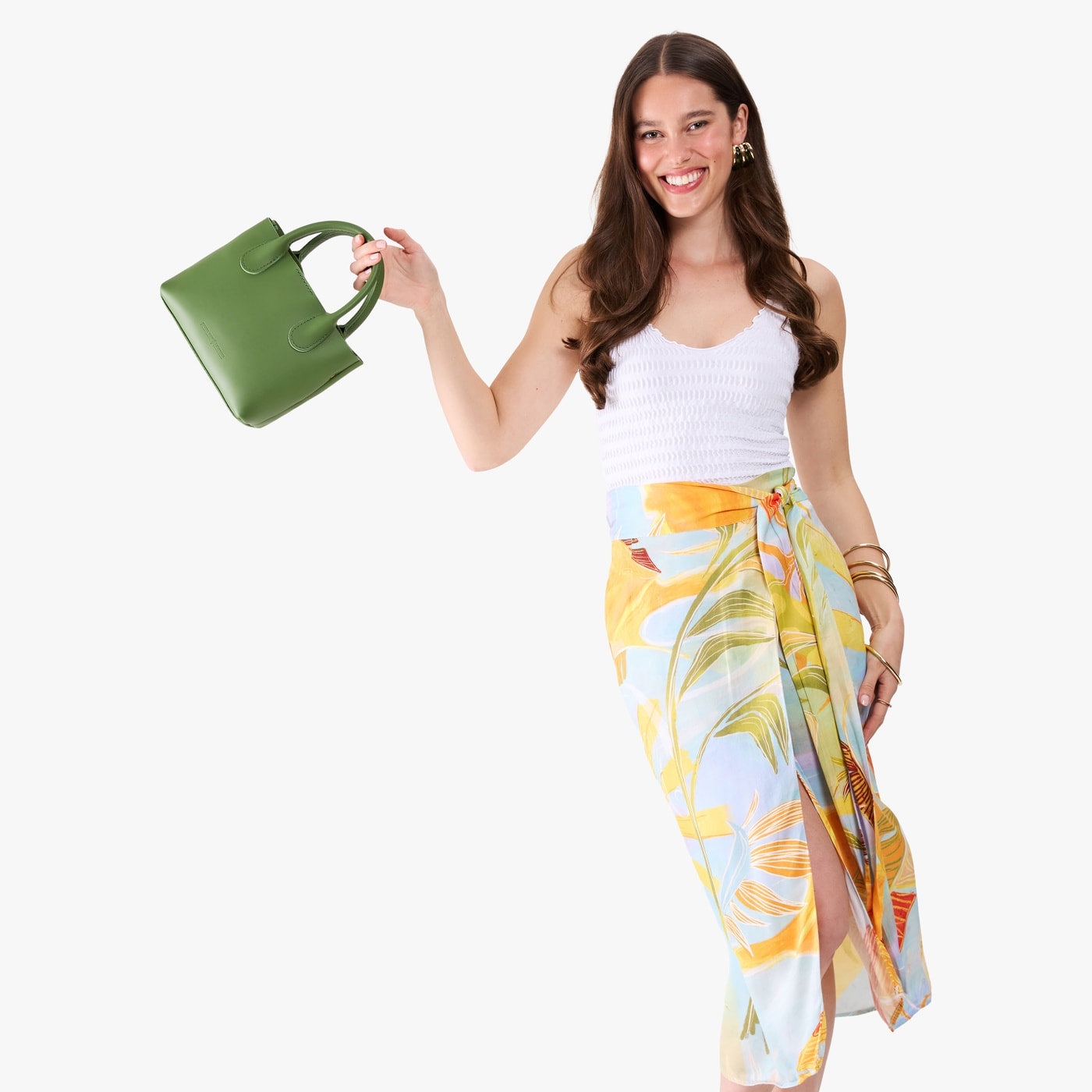 Cactus*Small | Model holding a petite tote purse with structured leather handles and crossbody strap