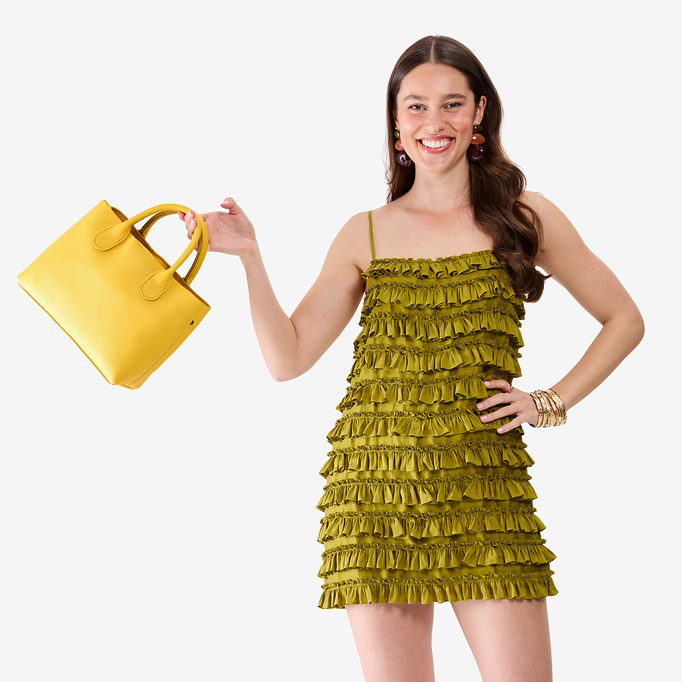 Canary*Large | Model holding a mid-size tote purse with structured leather handles and crossbody strap