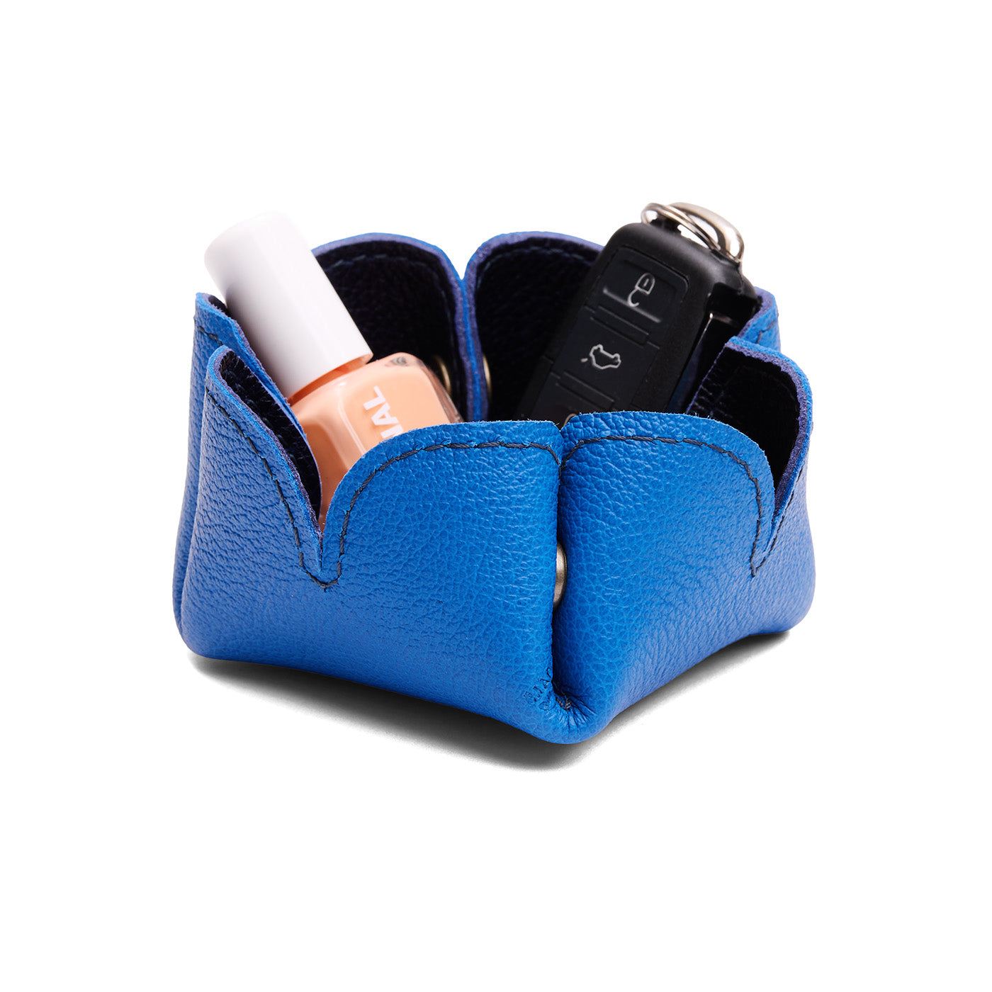 Cobalt | Desert bell-shaped foldable leather tray with snap-button corners holding items