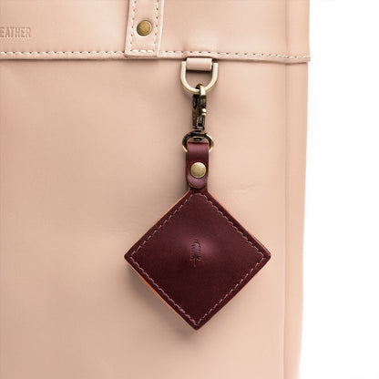 Cognac | Diamond shaped leather AirTag holder on a lobster clasp keychain