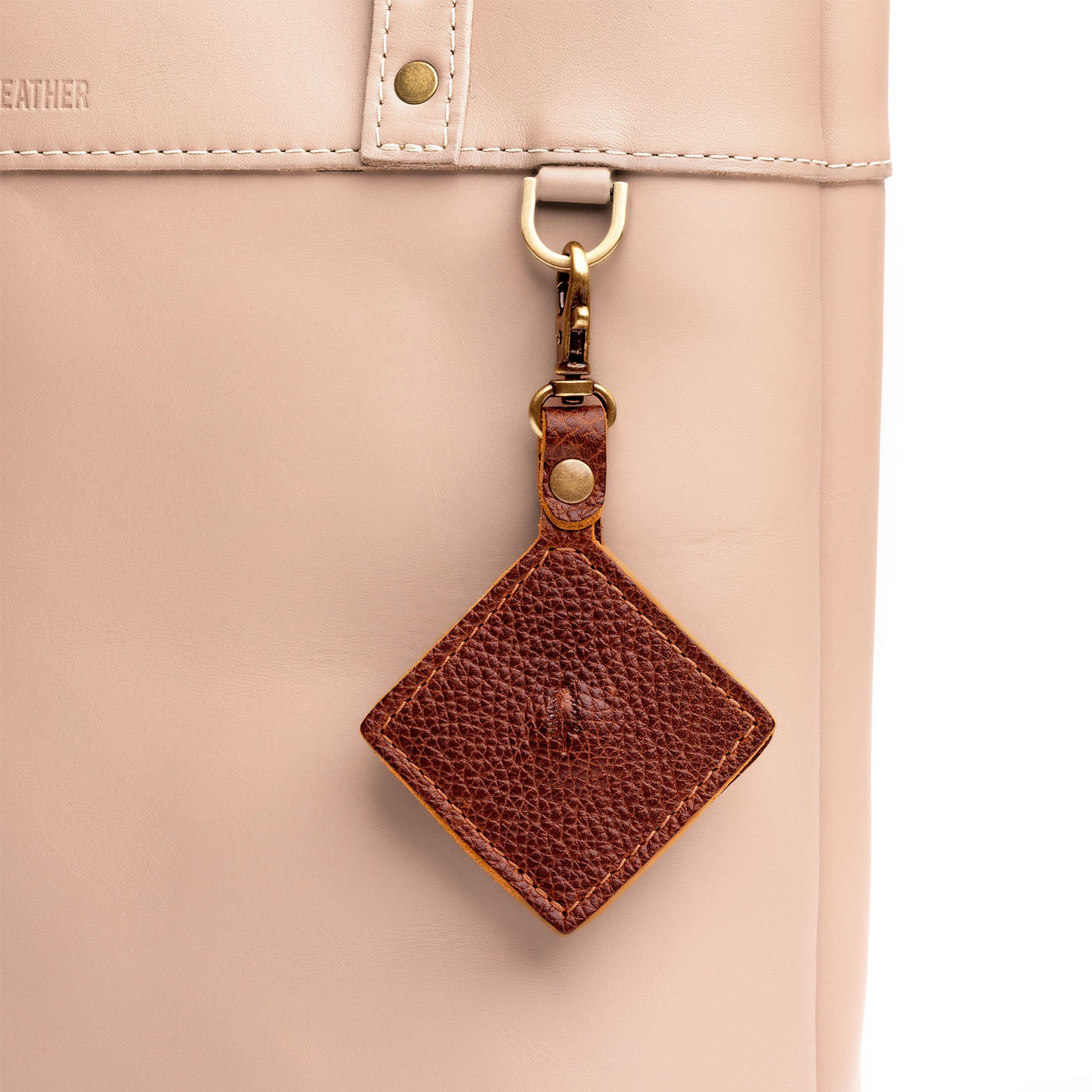 Nutmeg | Diamond shaped leather AirTag holder on a lobster clasp keychain