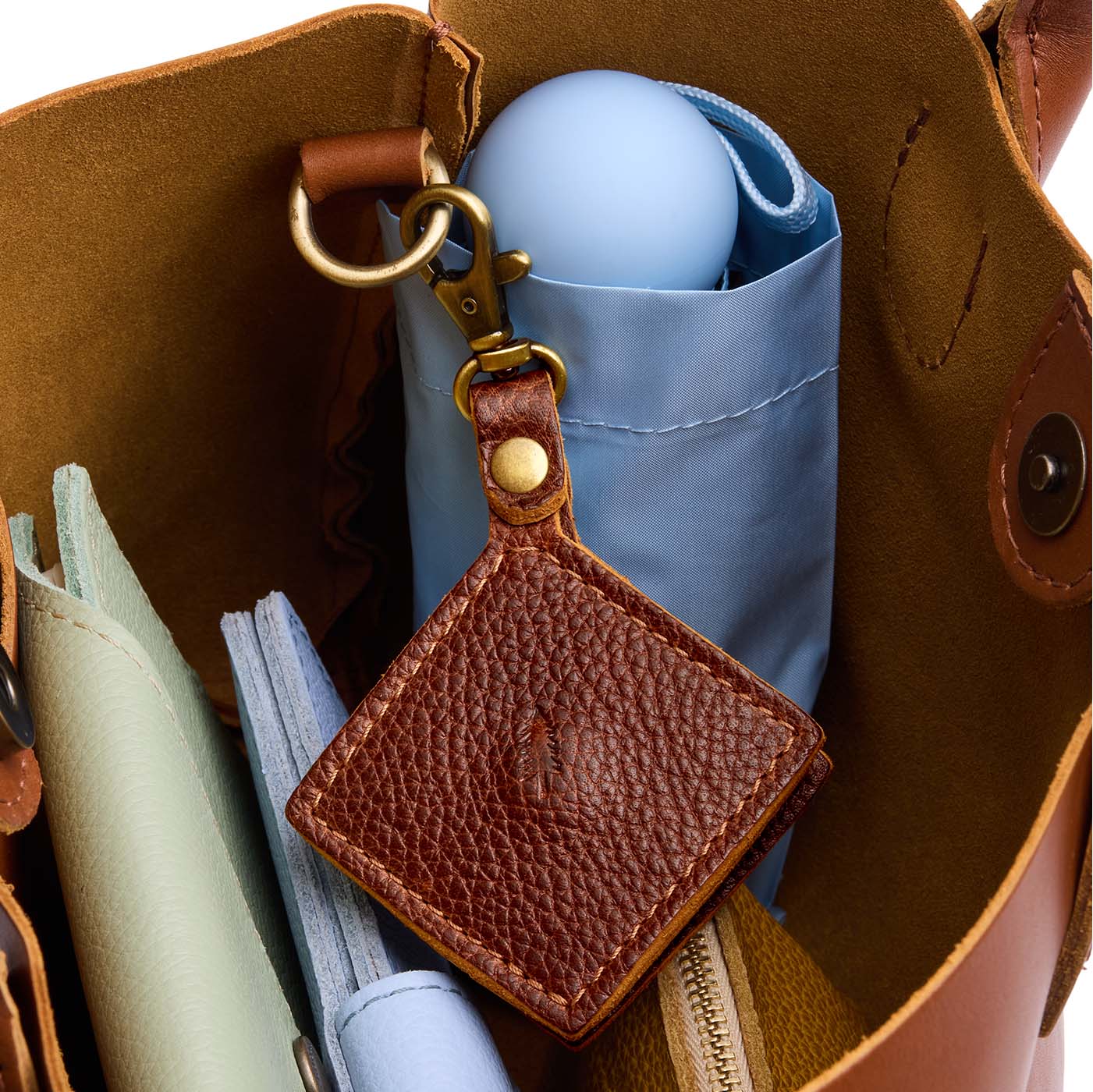 Nutmeg | Diamond shaped leather AirTag holder on a lobster clasp keychain