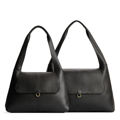 Pebbled--black | Comparison image of a slouchy triangle shaped shoulder bag with a flap