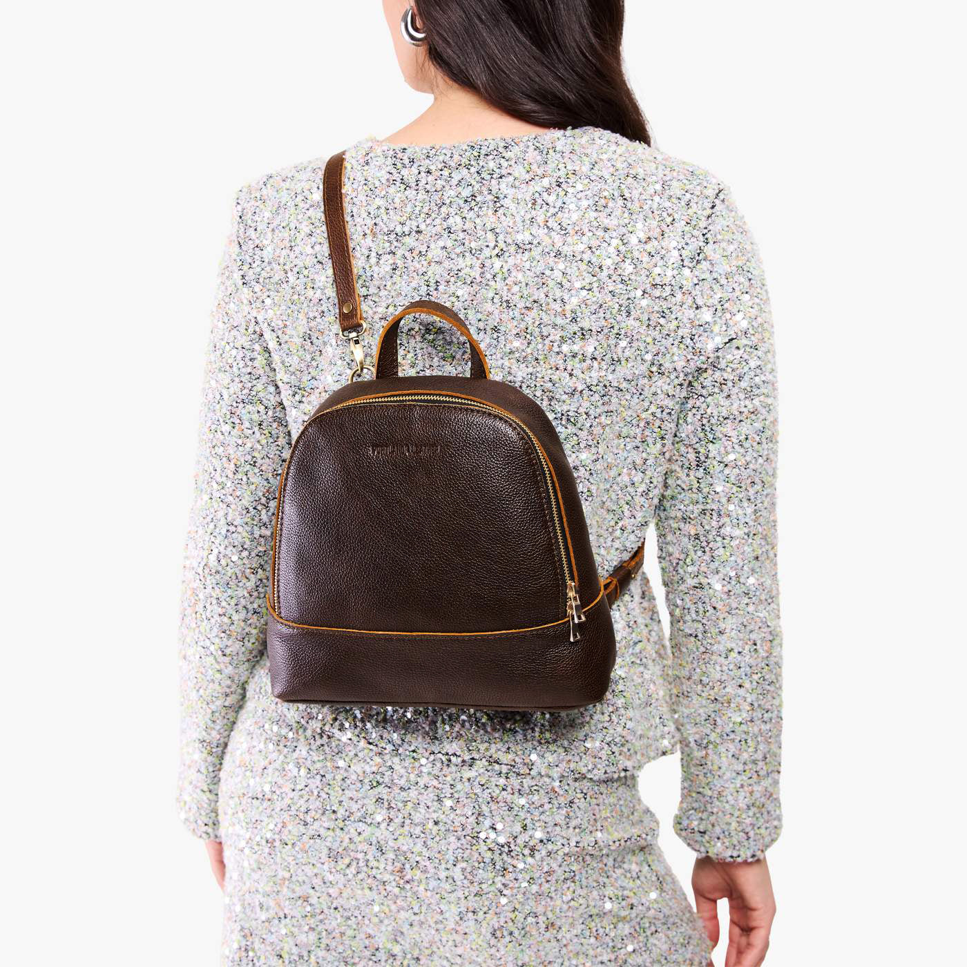 Coldbrew | Model wearing leather backpack with debossed Portland Leather logo on front