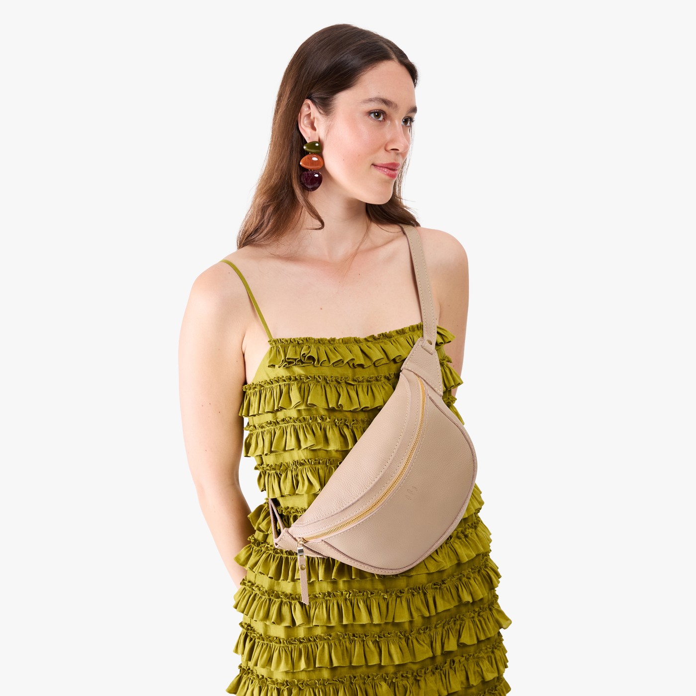 Oatmilk | Model wearing a sling bag with front zipper
