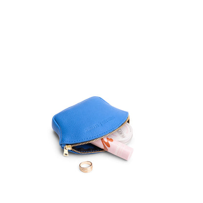 Skydive*Small | Seashell shaped leather makeup bag with curved top zipper and flat bottom