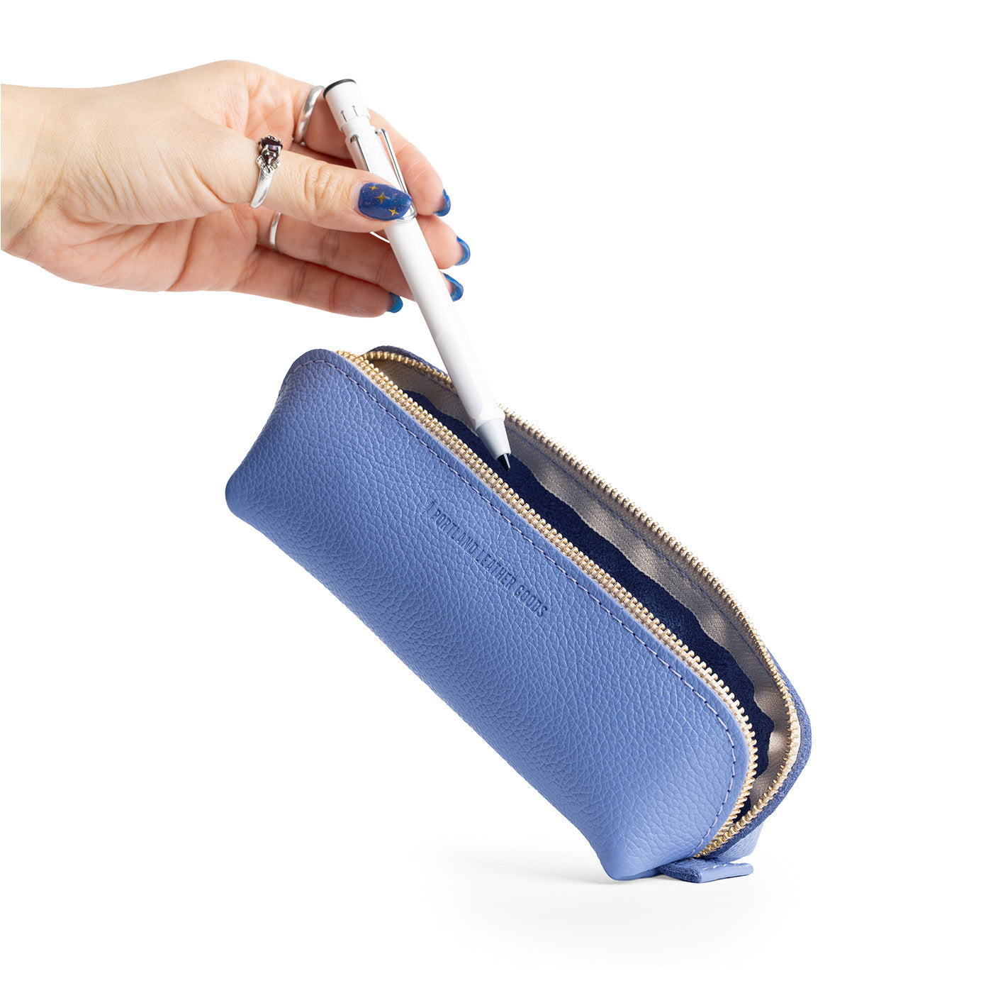 Aster | Leather pouch with curved seams and top zipper
