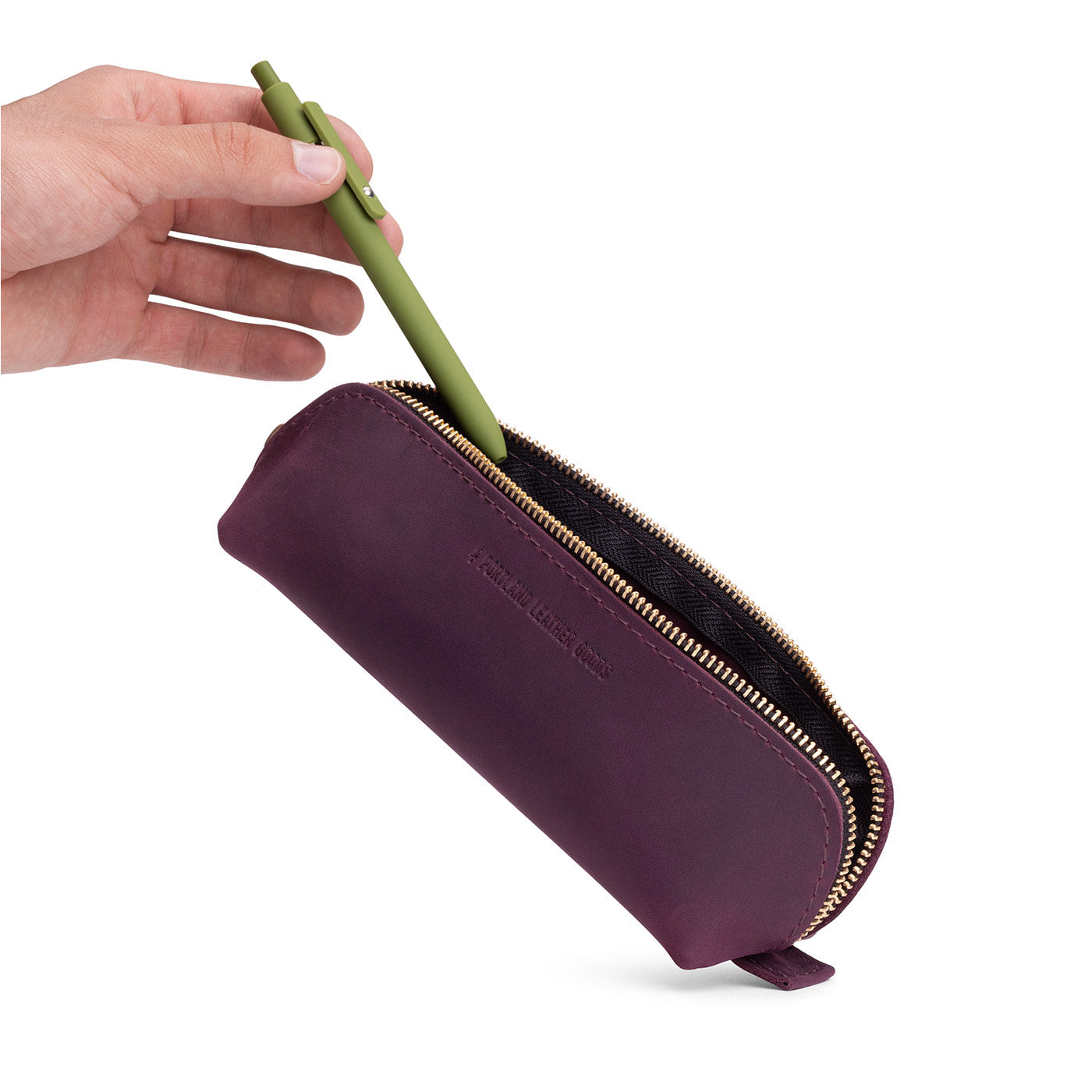 Larkspur | Leather pouch with curved seams and top zipper