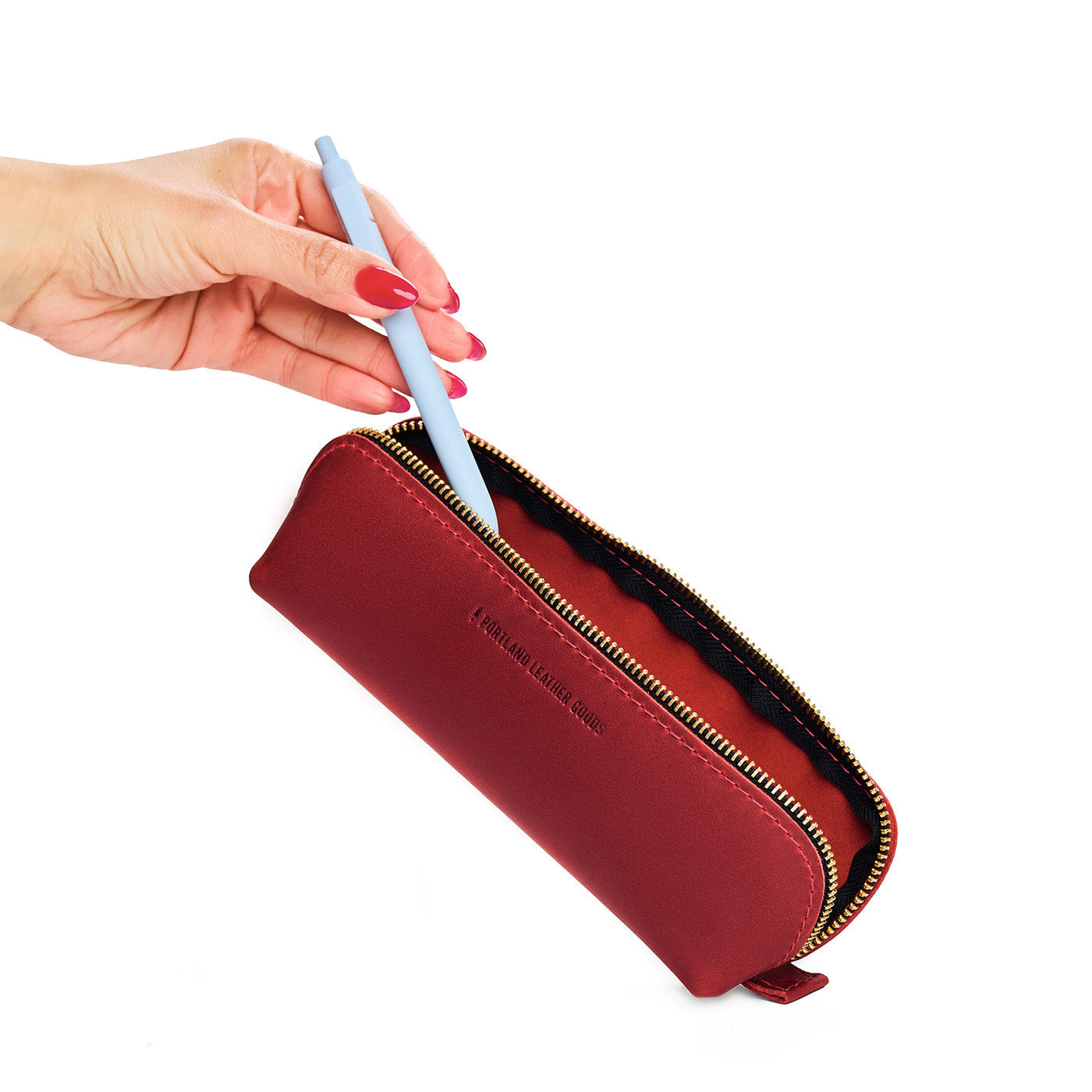 Phoenix | Leather pouch with curved seams and top zipper