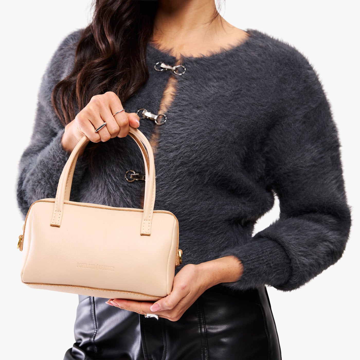 Moonflower*Small | Model holding mini duffle shaped handbag with crossbody strap