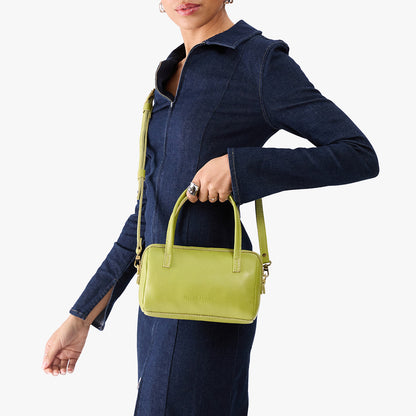 Wasabi*Small | Model holding mini duffle shaped handbag with crossbody strap