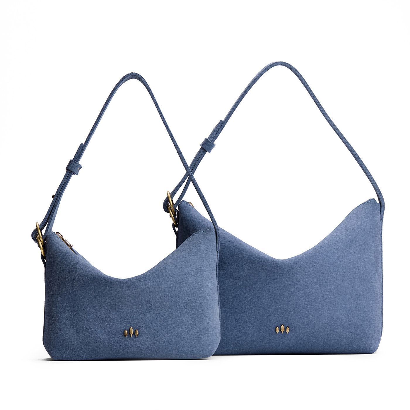 Denim | Size comparison shot of small and large slouchy shoulder bags with zipper opening and three metal tree emblems