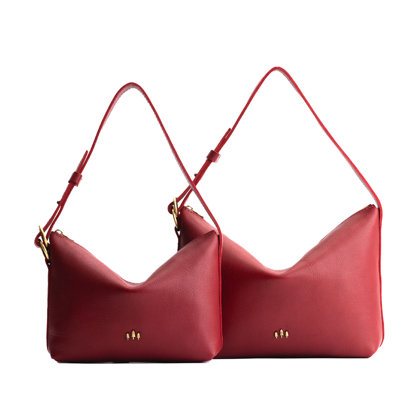 Flamenco | Size comparison shot of small and large slouchy leather shoulder bags with zipper opening and three metal tree emblems