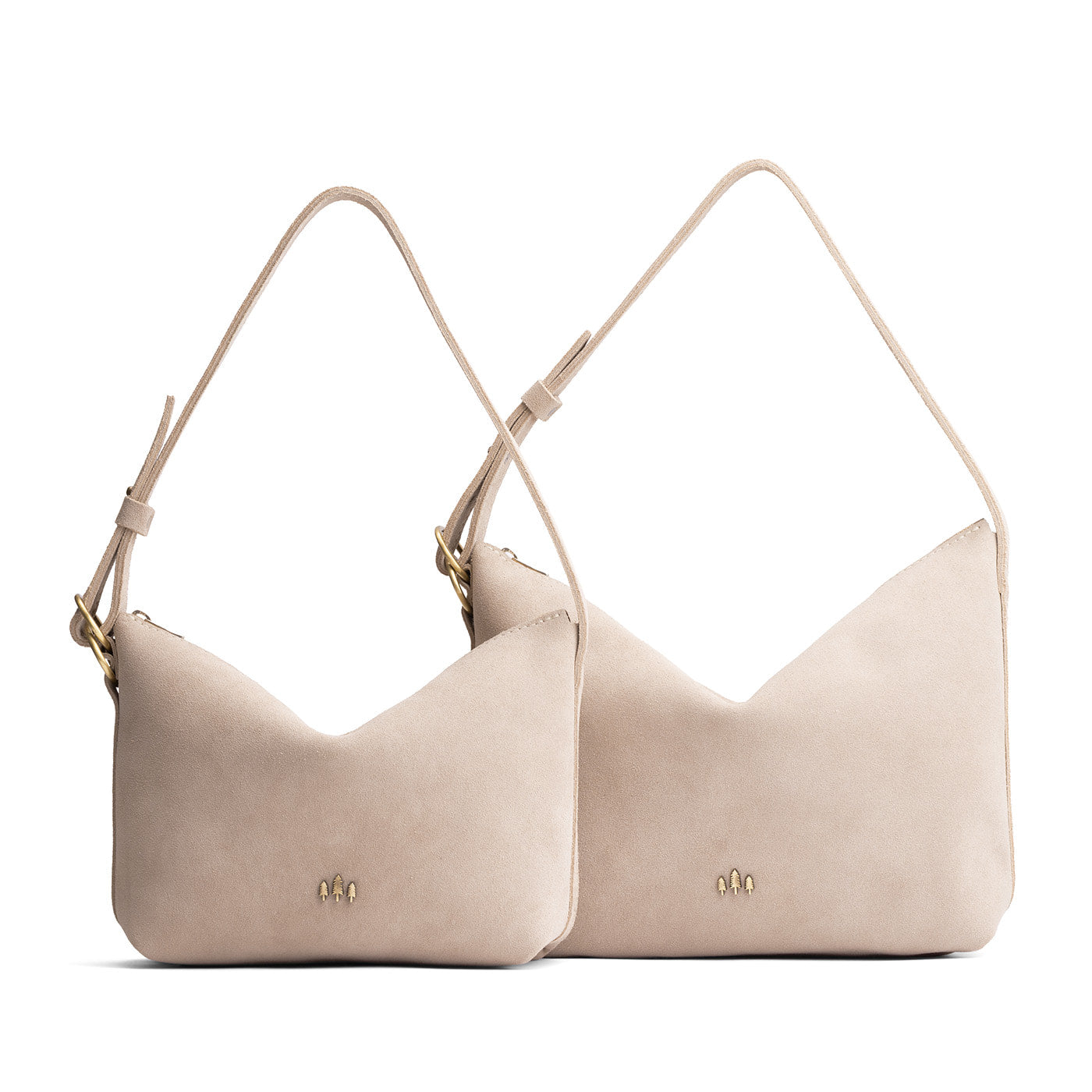 Taupe | Size comparison shot of small and large slouchy shoulder bags with zipper opening and three metal tree emblems