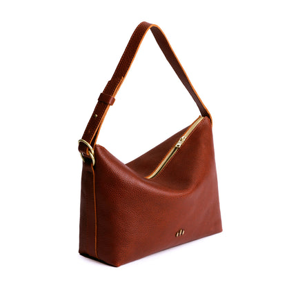 Nutmeg*Large | Medium sized slouchy leather shoulder bag with zipper opening and three metal tree emblems