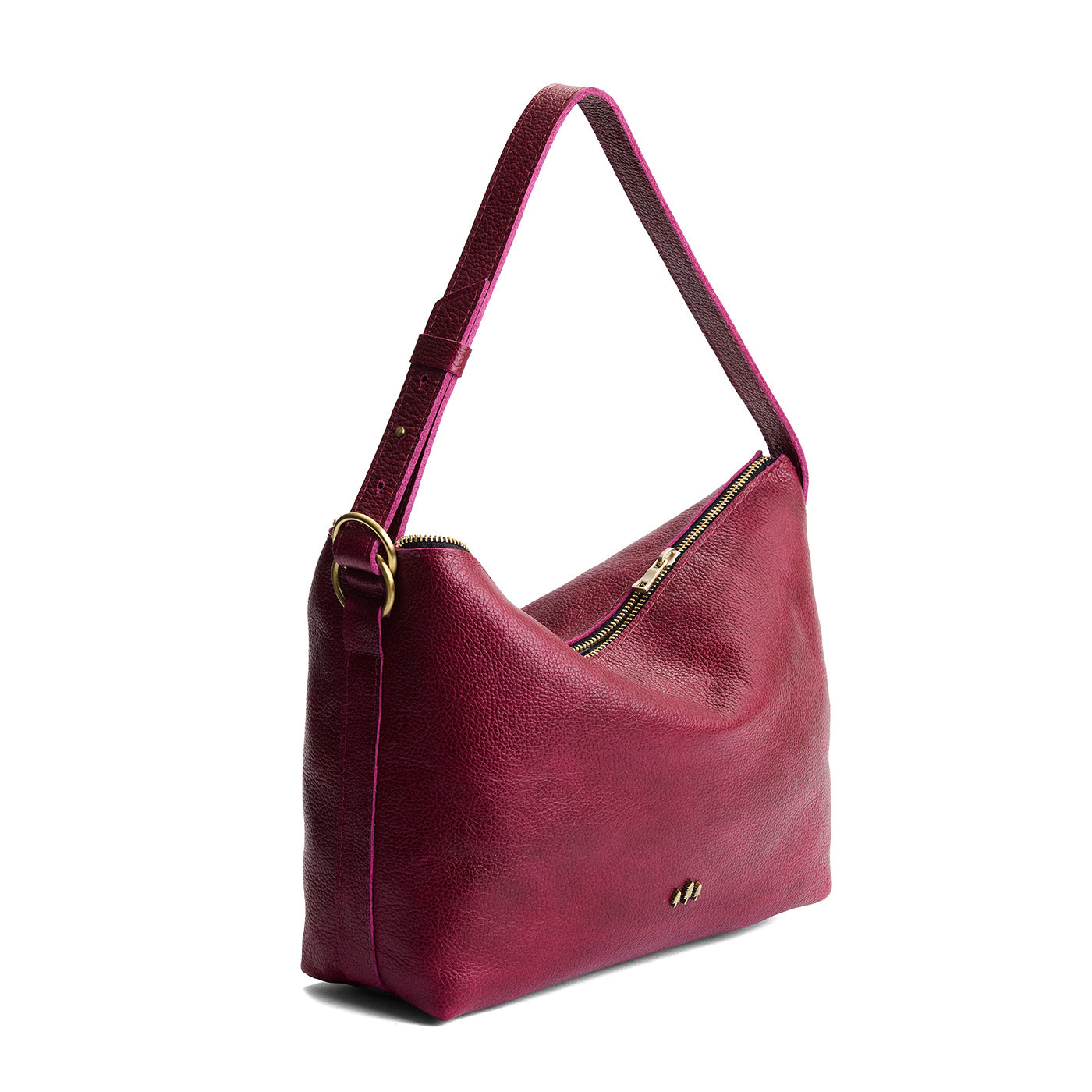 Orchid*Large | Model Wearing medium sized slouchy leather shoulder bag with zipper opening and three metal tree emblems