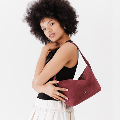 Red Panda*Small | Model wearing petite slouchy leather shoulder bag with zipper opening and three metal tree emblems
