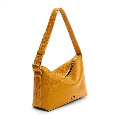 Sunshine*Small | Slouchy Shoulder Bag that has a zipper opening and three metal tree emblems on a white background