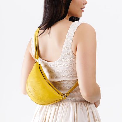 Naples*Small | Model wearing petite half circle shaped sling bag