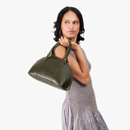 Pebbled Olive*Small | Model holding a half circle crossbody bag with handles and removable crossbody strap