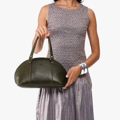 Pebbled Olive*Small | Model holding a half circle crossbody bag with handles and removable crossbody strap