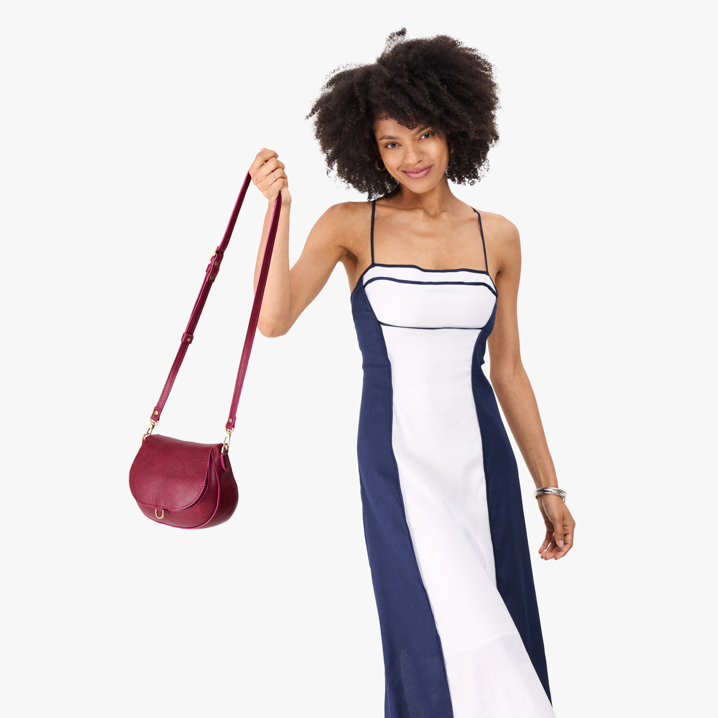 Orchid*Small | Model wearing a petite leather Crossbody with a flap and magnetic closure