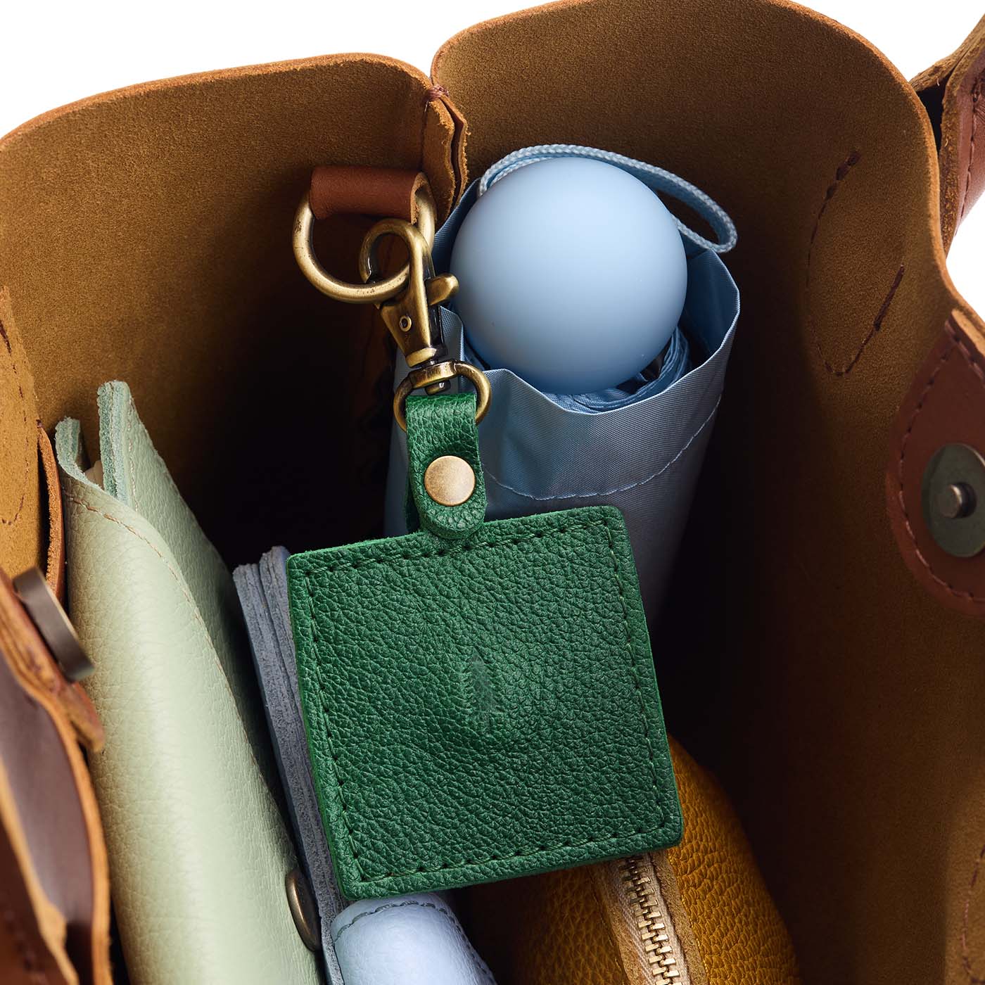 Bacalar | Square-shaped leather AirTag holder with snap closure and swivel lobster claw clasp