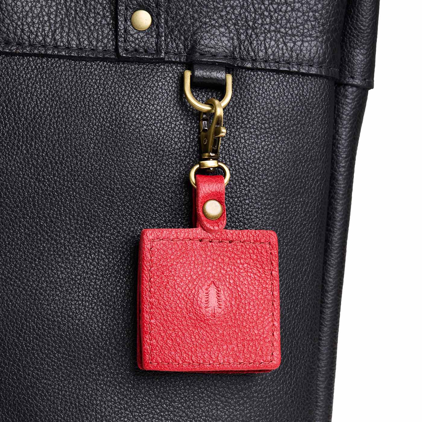 Cherry | Square-shaped leather AirTag holder with snap closure and swivel lobster claw clasp