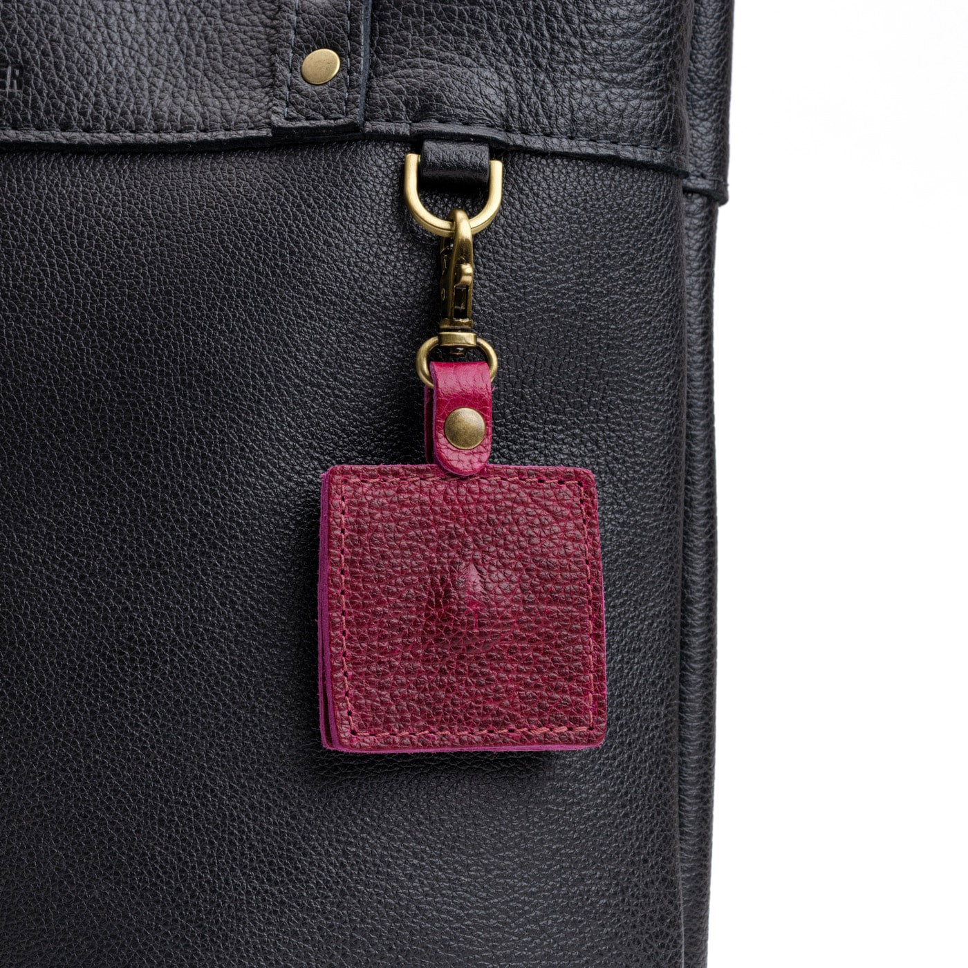 Orchid | Square-shaped leather AirTag holder with snap closure and swivel lobster claw clasp