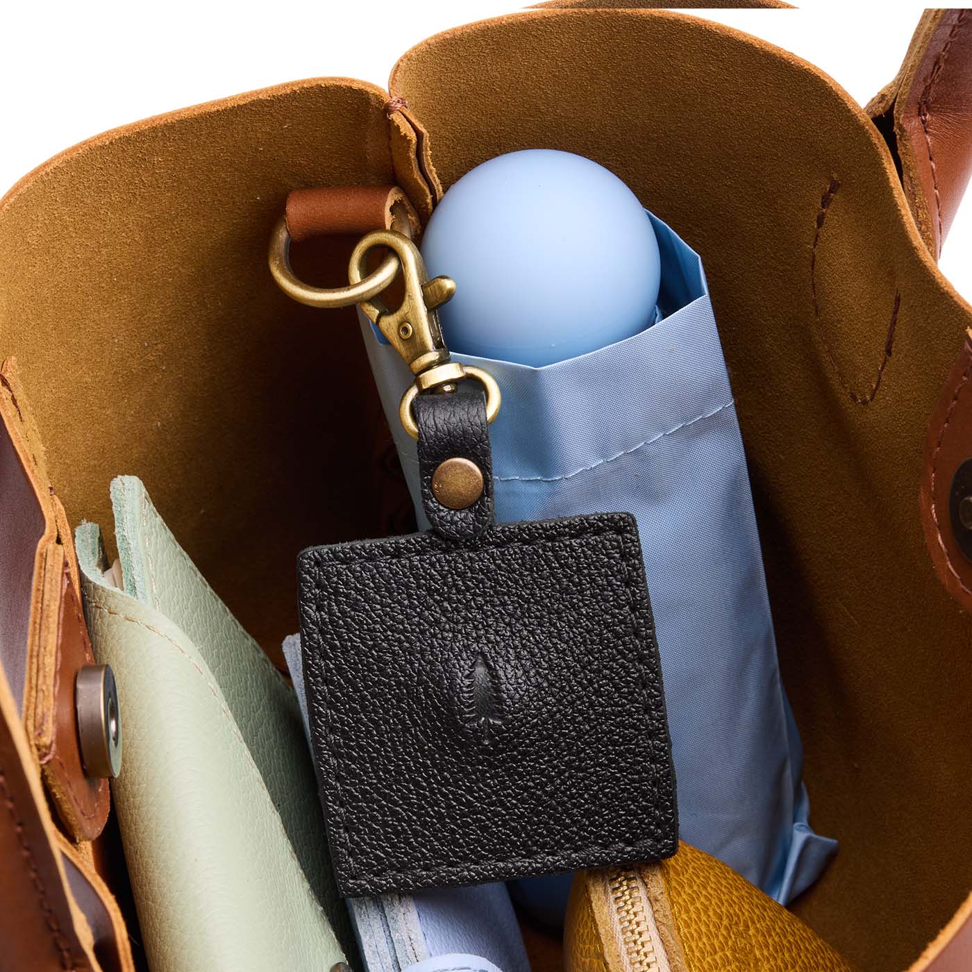 Pebbled--black | Square-shaped leather AirTag holder with snap closure and swivel lobster claw clasp