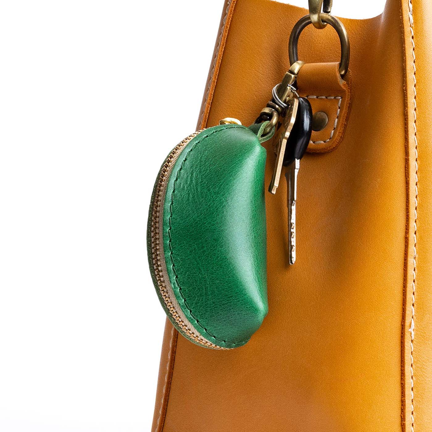 Cowboy Mint | Taco shaped leather pouch with zipper and swivel lobster clasp on bag