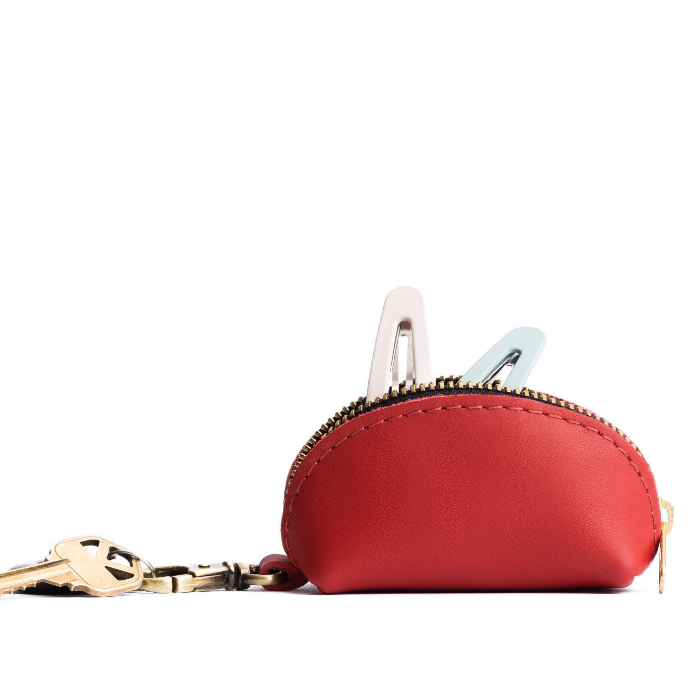 Crimson | Taco shaped leather pouch with zipper and swivel lobster clasp on white background