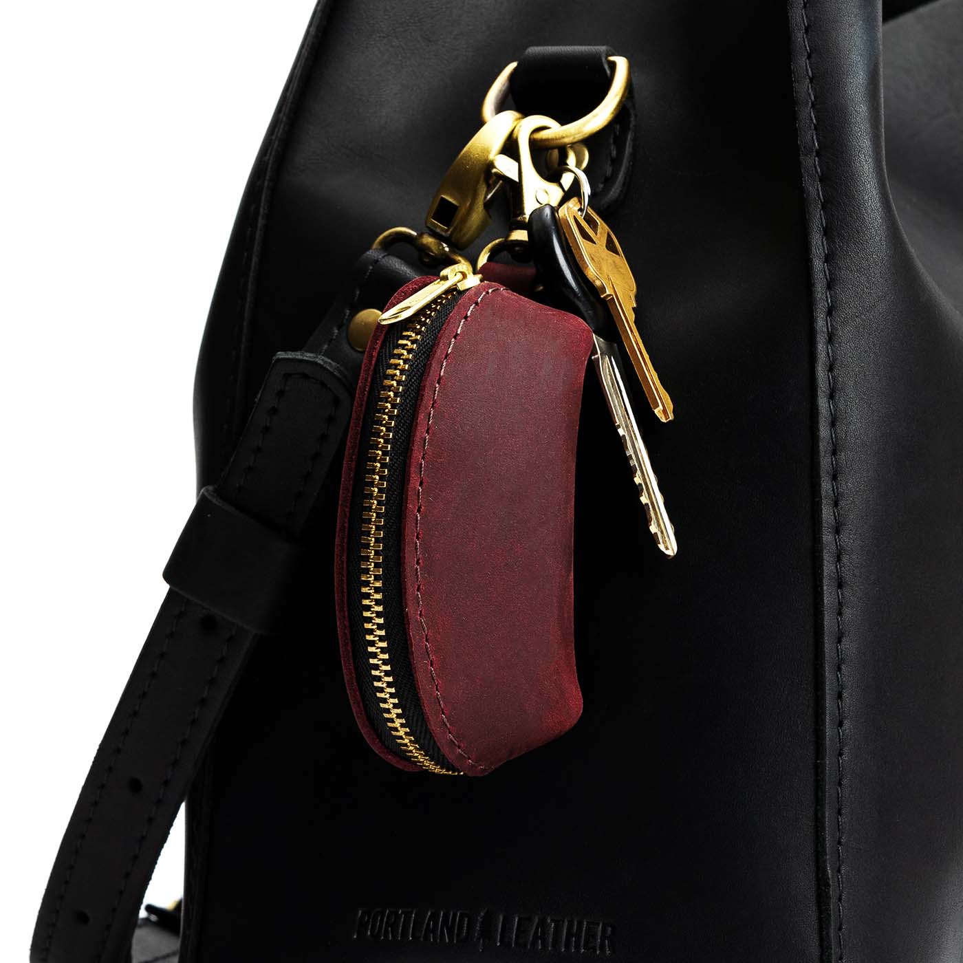 Merlot | Taco shaped leather pouch with zipper and swivel lobster clasp on bag